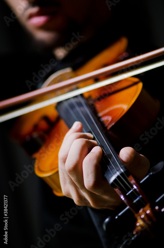 Young violin player playing