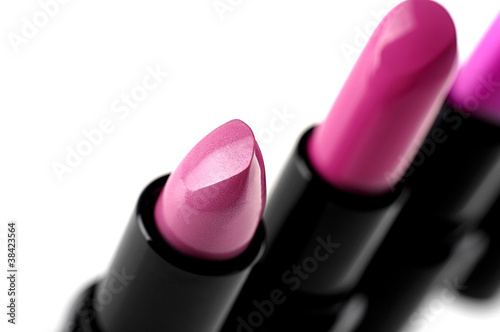 Pink lipsticks isolated on white
