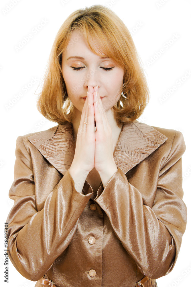 Praying woman in business suit with gold Praying woman in business suit with gold