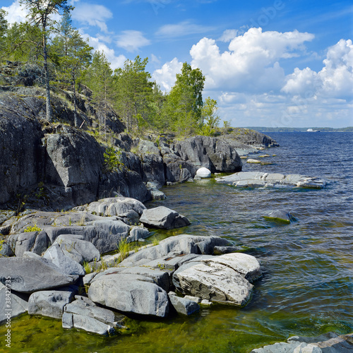 Stony shore of Ladoga lake, Russia photo