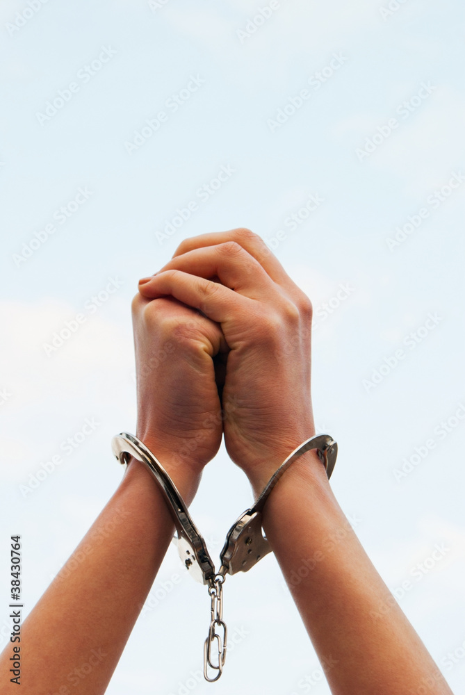 Hands handcuffed