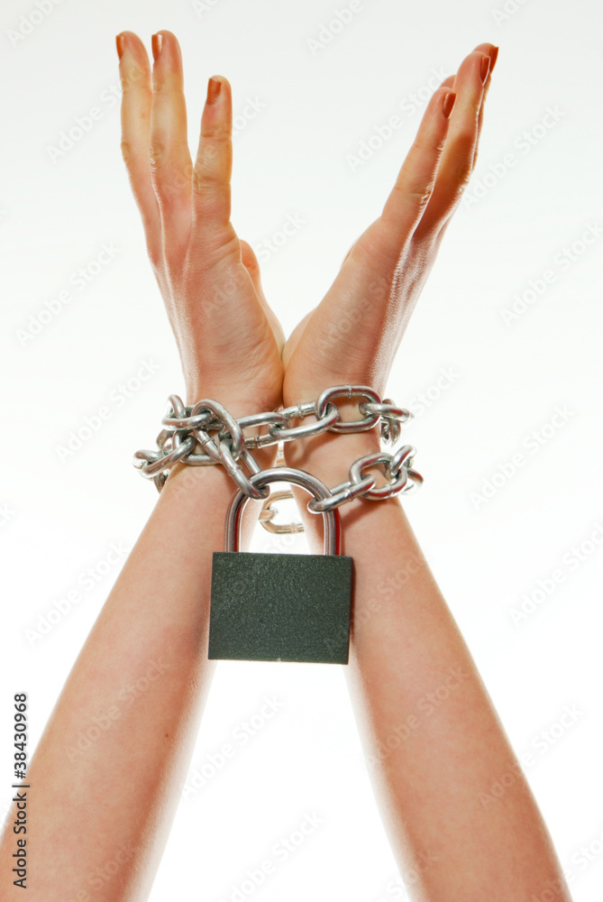 Hands tied up with chains