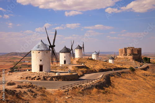 Windmills and castle of Consuegra. Spain photo