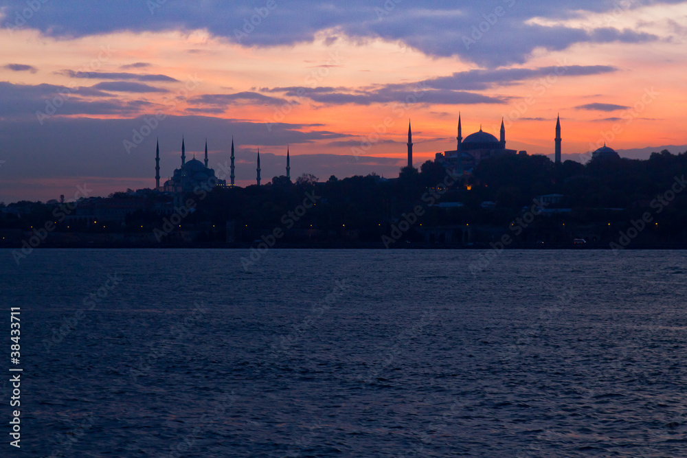 Blue Mosque and Hagia Sophia in sunset scene