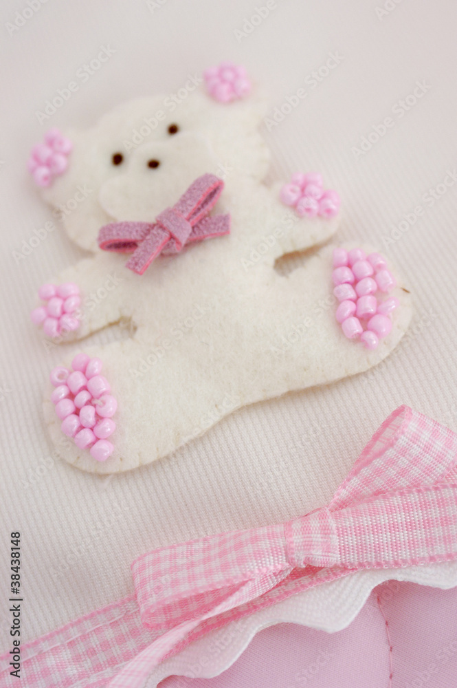Teddy bear plush fabric background with staple