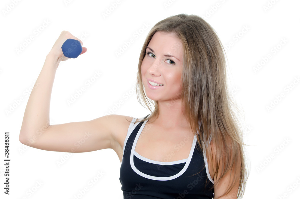 The girl does exercises with dumbbells The girl does exercises with dumbbells