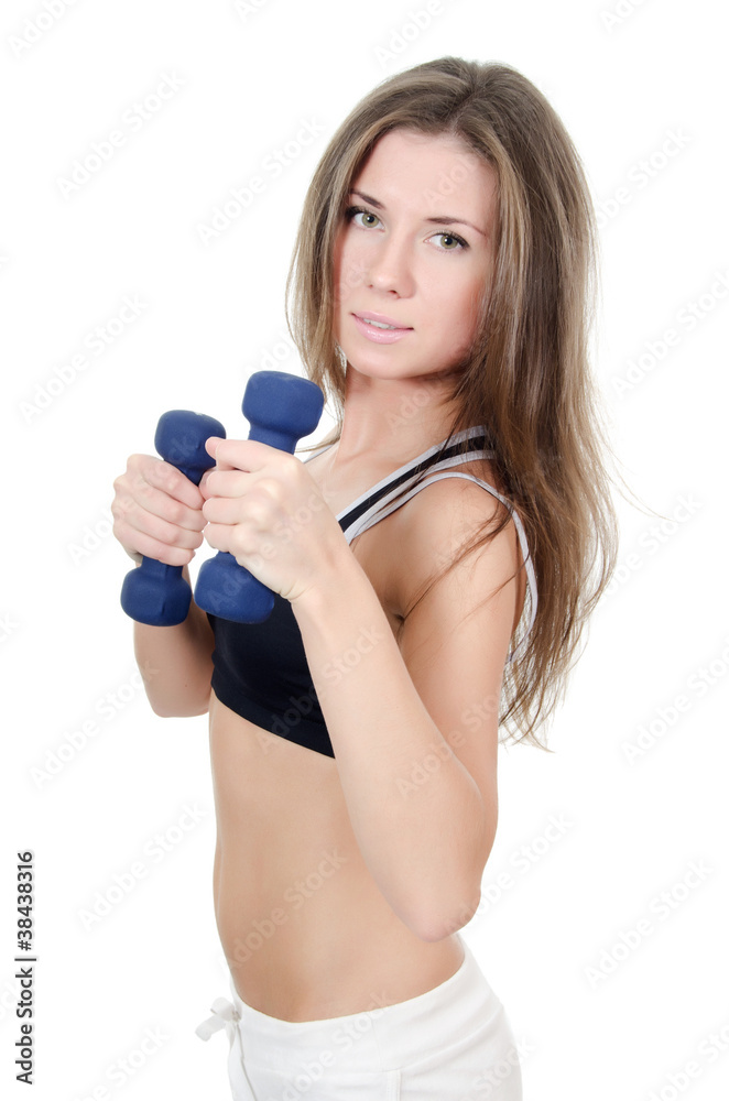 The girl does exercises with dumbbells The girl does exercises with dumbbells