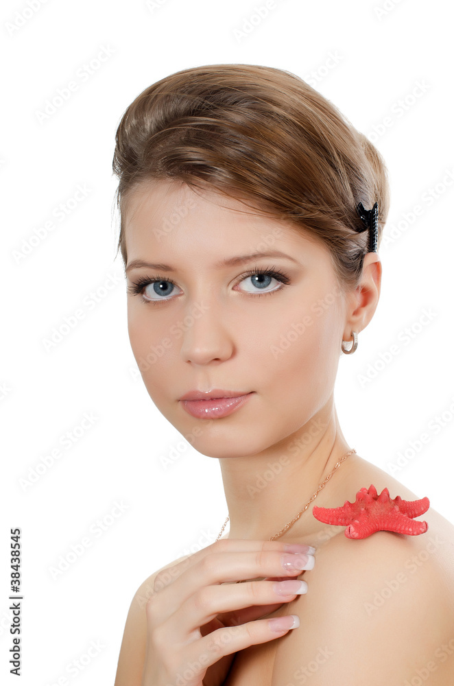 The young beautiful girl with starfish The young beautiful girl with starfish