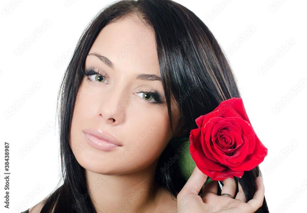 The girl with beautiful hair with a red rose