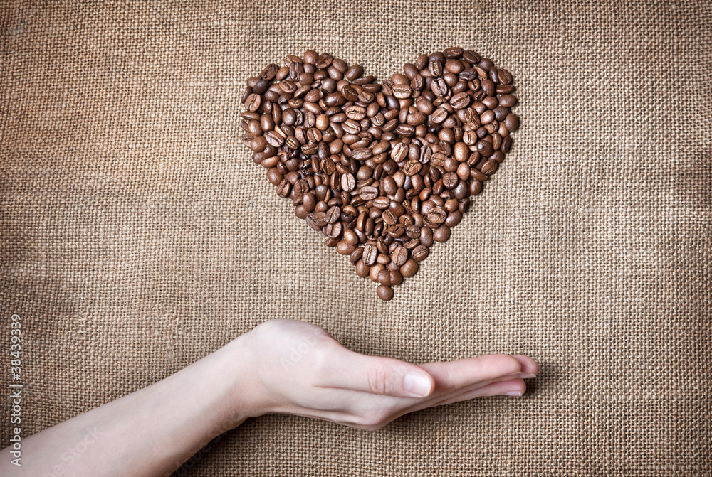 Woman holding coffee Heart