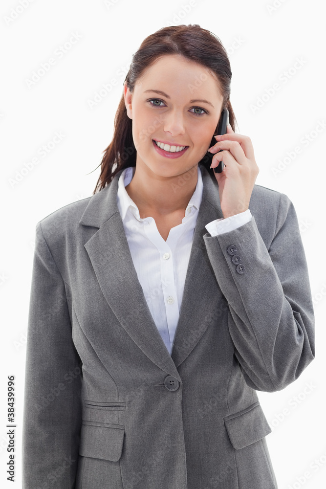 Businesswoman smiling over the phone Businesswoman smiling over the phone