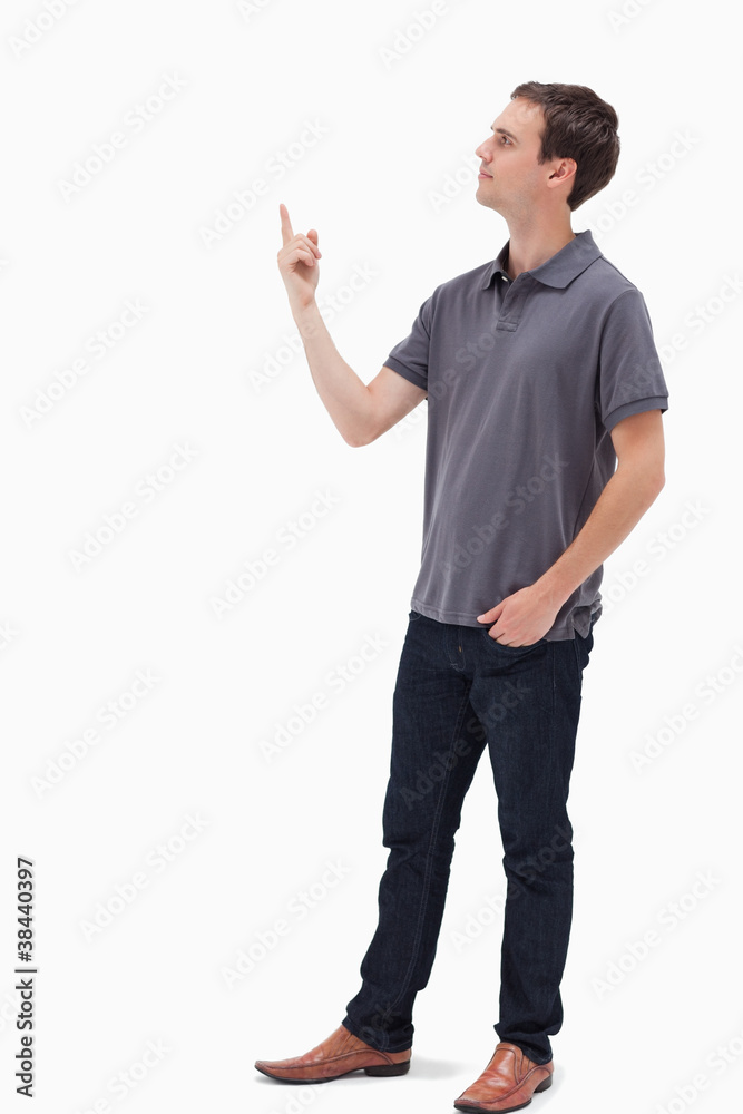 Man standing and presenting something above