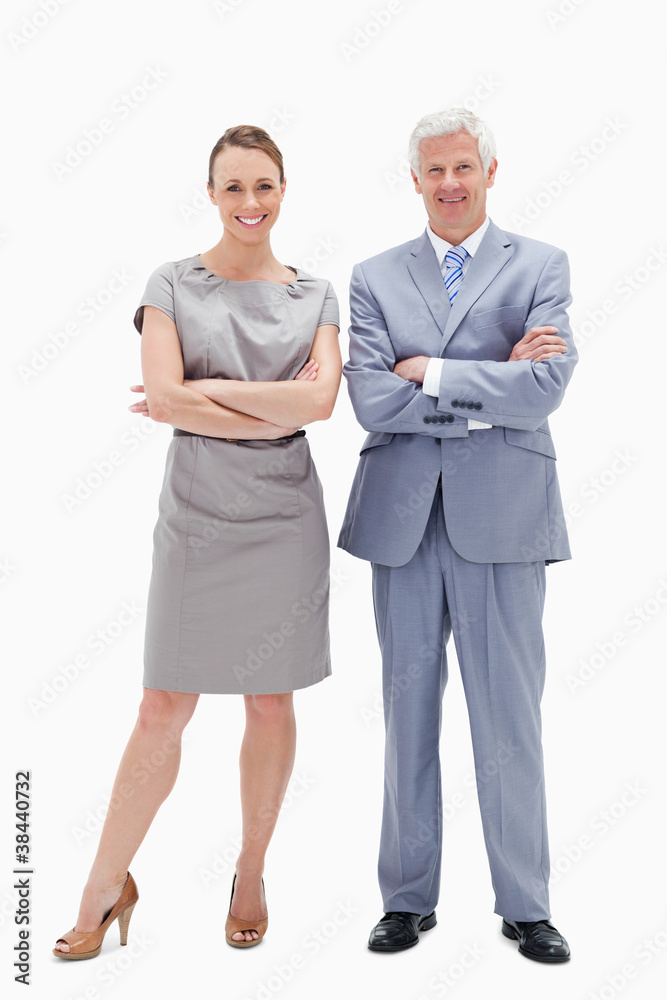 White hair man with woman crossing their arms and smiling White hair man with woman crossing their arms and smiling