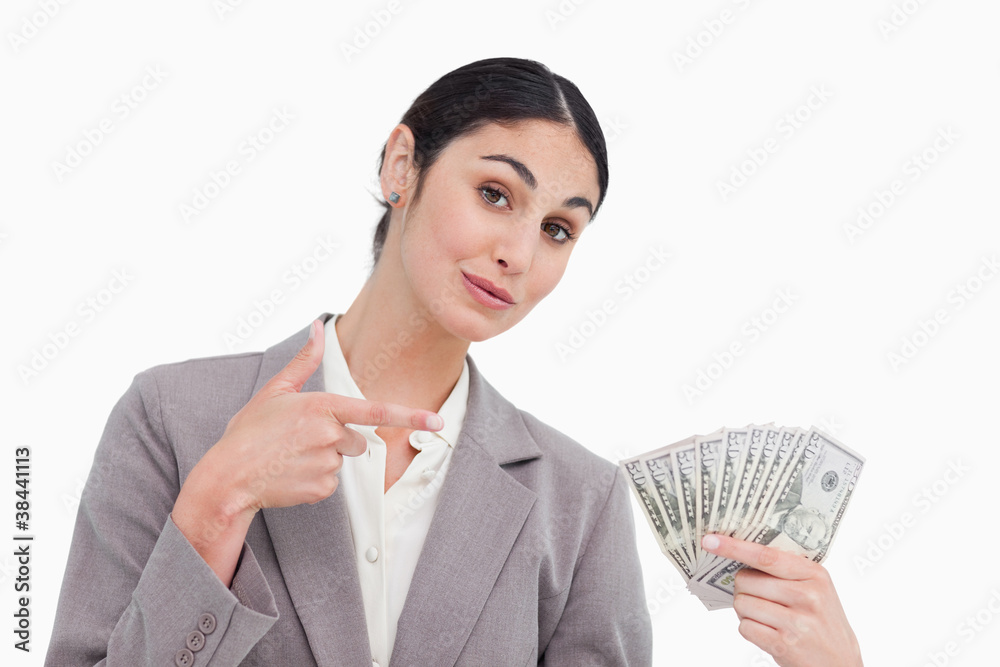 Saleswoman pointing at bank notes in her hand Saleswoman pointing at bank notes in her hand