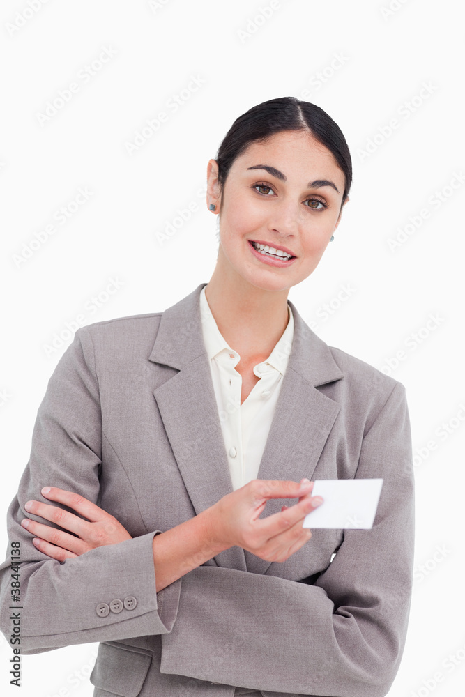 Saleswoman with arms folded and business card Saleswoman with arms folded and business card