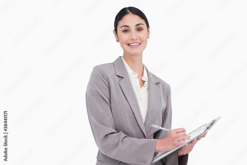 Smiling businesswoman with pen and clipboard Smiling businesswoman with pen and clipboard