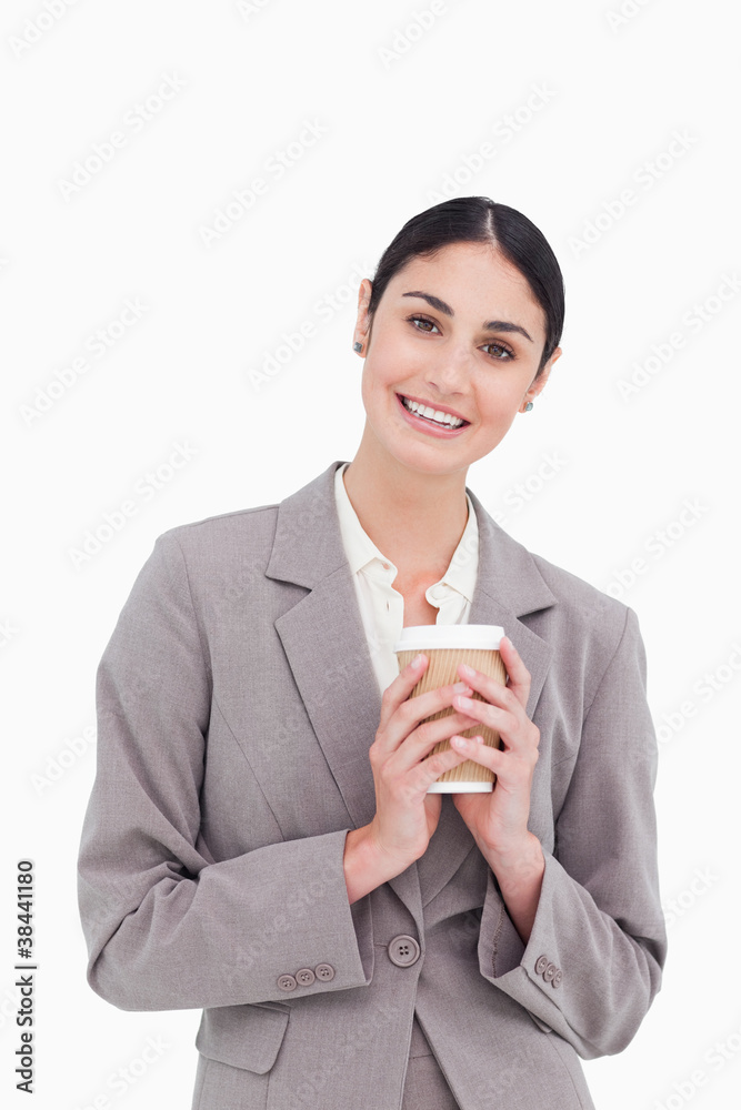 Smiling businesswoman holding paper cup Smiling businesswoman holding paper cup