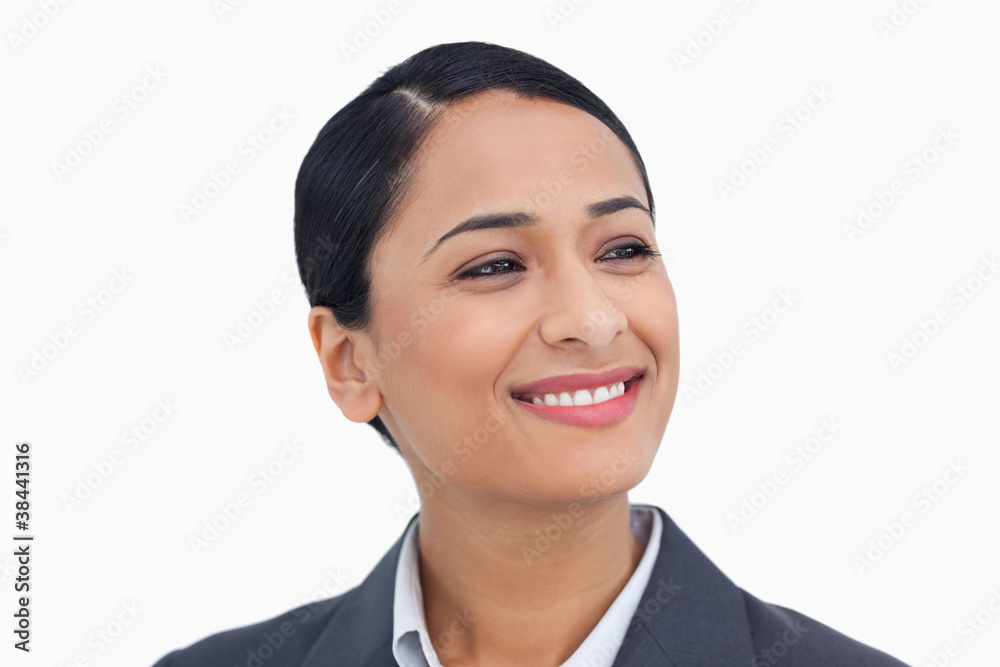Close up of smiling saleswoman looking to the side Close up of smiling saleswoman looking to the side