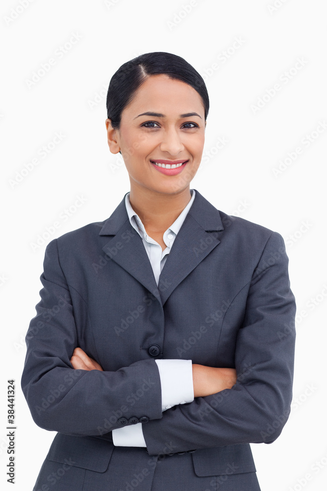 Close up of smiling saleswoman with arms folded Close up of smiling saleswoman with arms folded