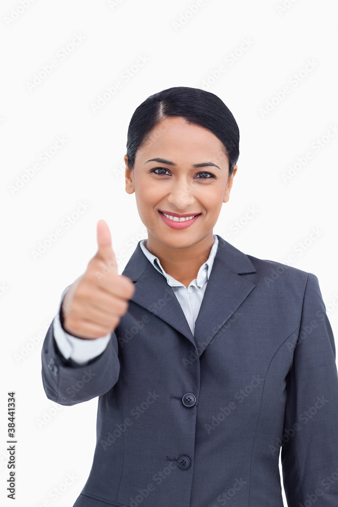 Close up of smiling saleswoman giving thumb up Close up of smiling saleswoman giving thumb up