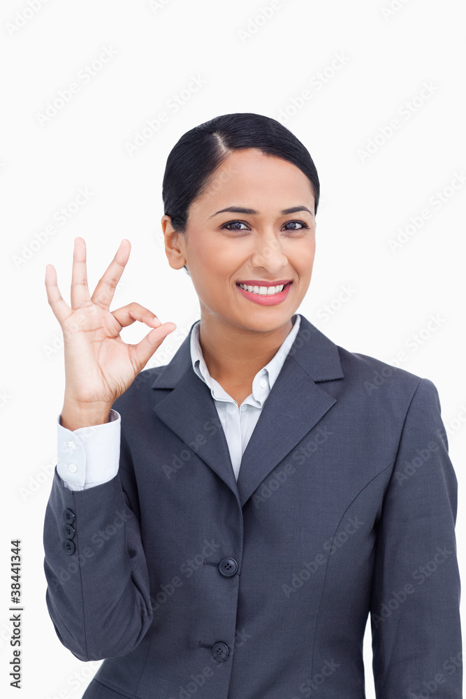 Close up of smiling saleswoman giving approval Close up of smiling saleswoman giving approval