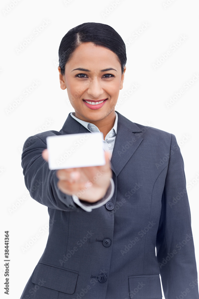 Close up of smiling saleswoman showing her business card Close up of smiling saleswoman showing her business card