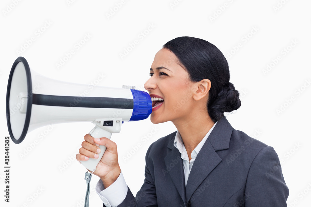Close up of saleswoman shouting through megaphone Close up of saleswoman shouting through megaphone