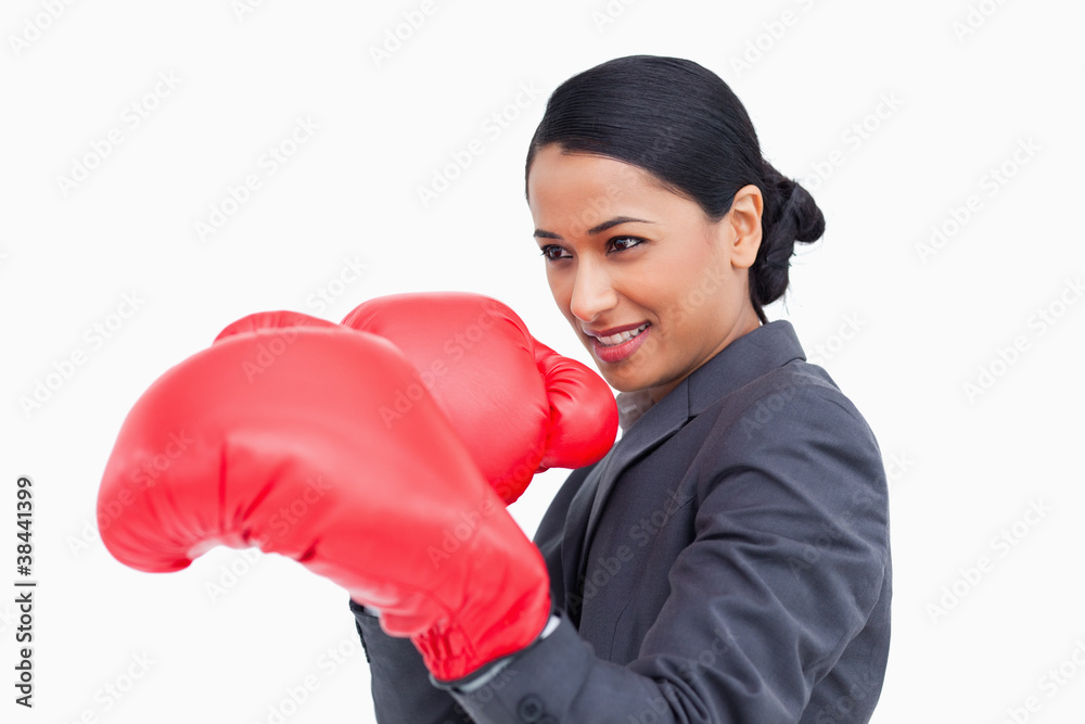Close up side view of saleswoman with boxing gloves