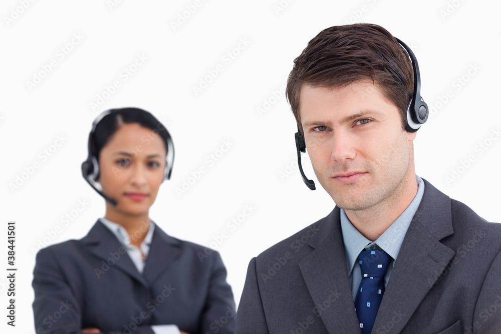 Close up of serious looking call center agents Close up of serious looking call center agents