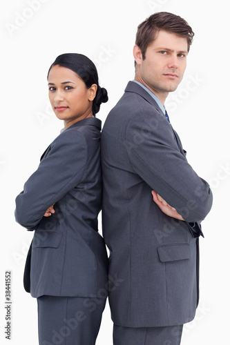 Close up of confident salesteam standing back to back photo