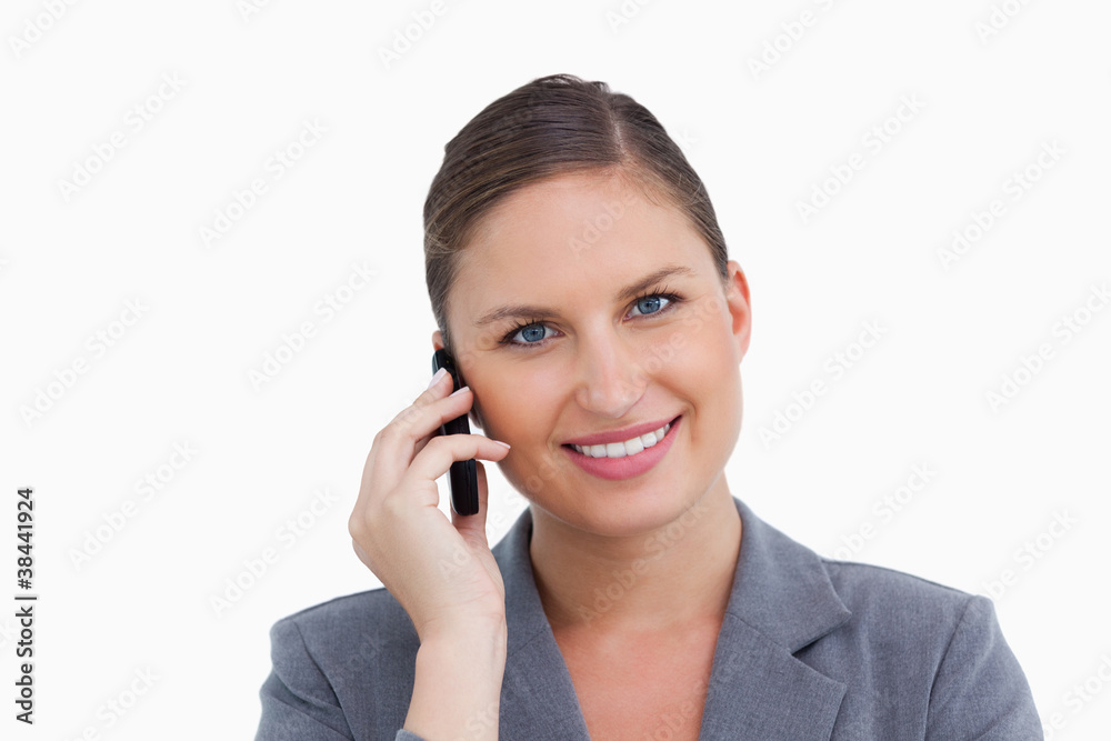 Close up of smiling tradeswoman on her cellphone Close up of smiling tradeswoman on her cellphone