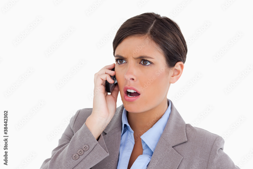 Close up of angry entrepreneur on her cellphone Close up of angry entrepreneur on her cellphone