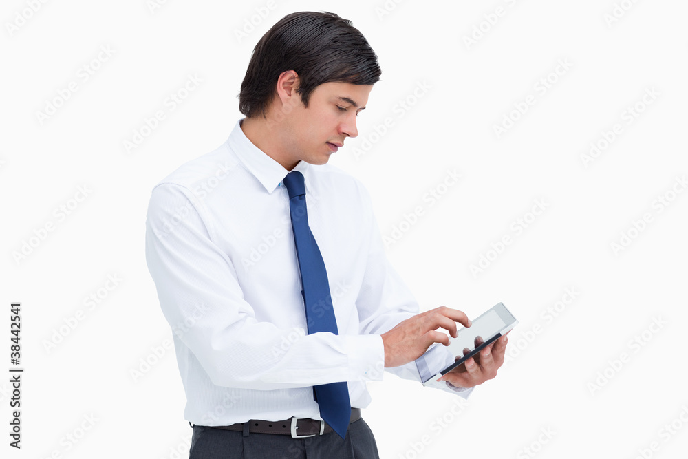 Side view of tradesman using tablet computer Side view of tradesman using tablet computer
