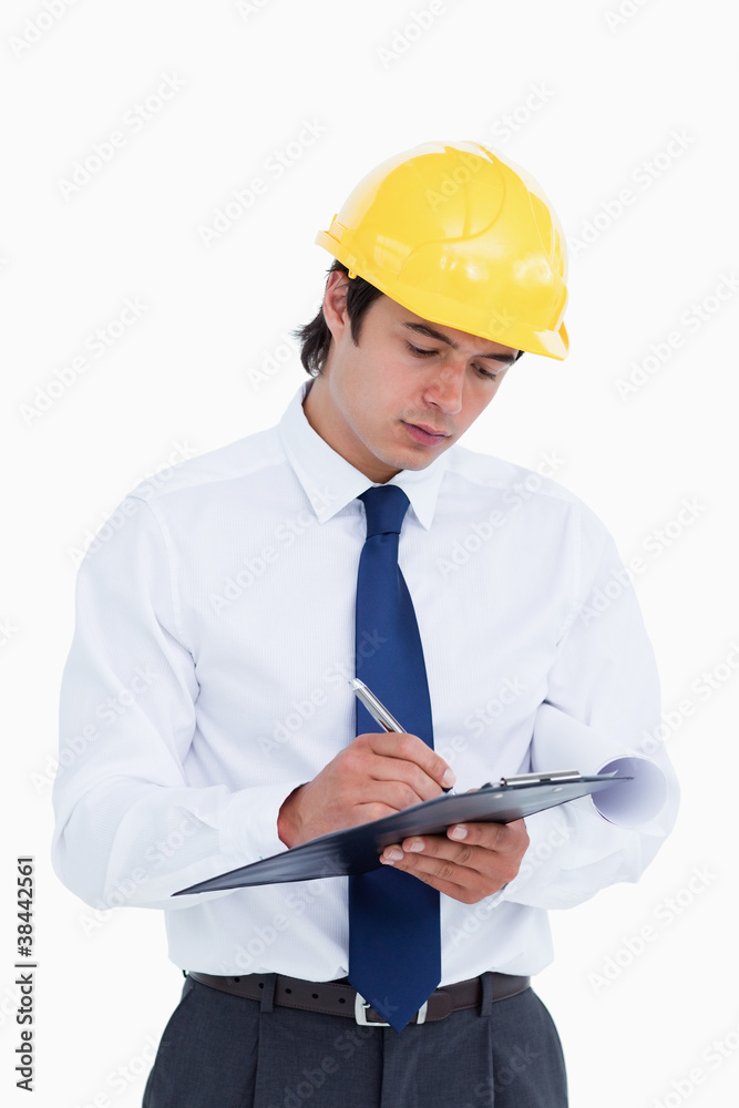 Close up of male architect taking notes Close up of male architect taking notes