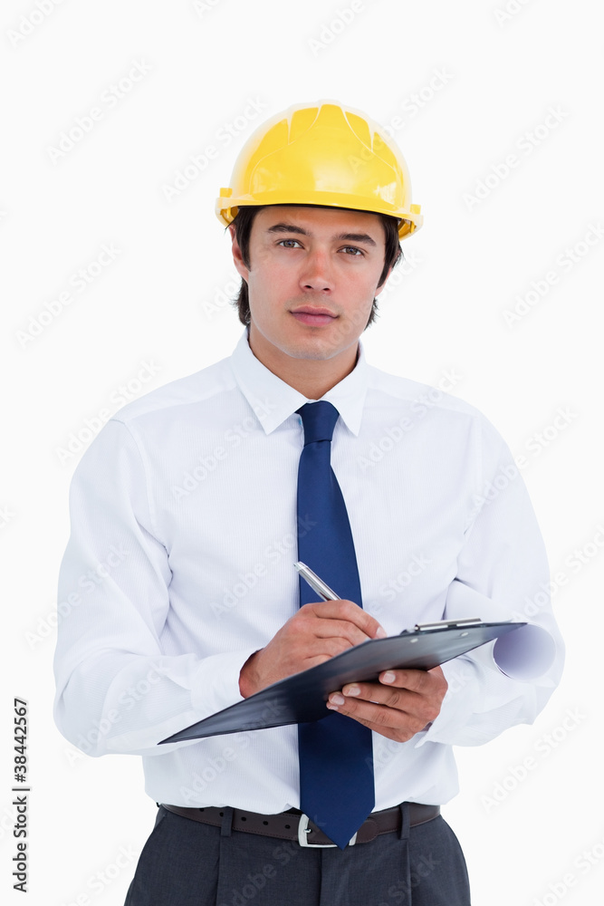 Male architect with clipboard and pen Male architect with clipboard and pen