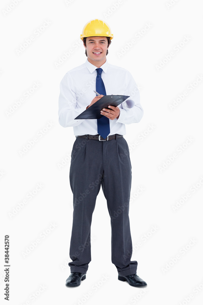 Smiling male architect with pen and clipboard Smiling male architect with pen and clipboard