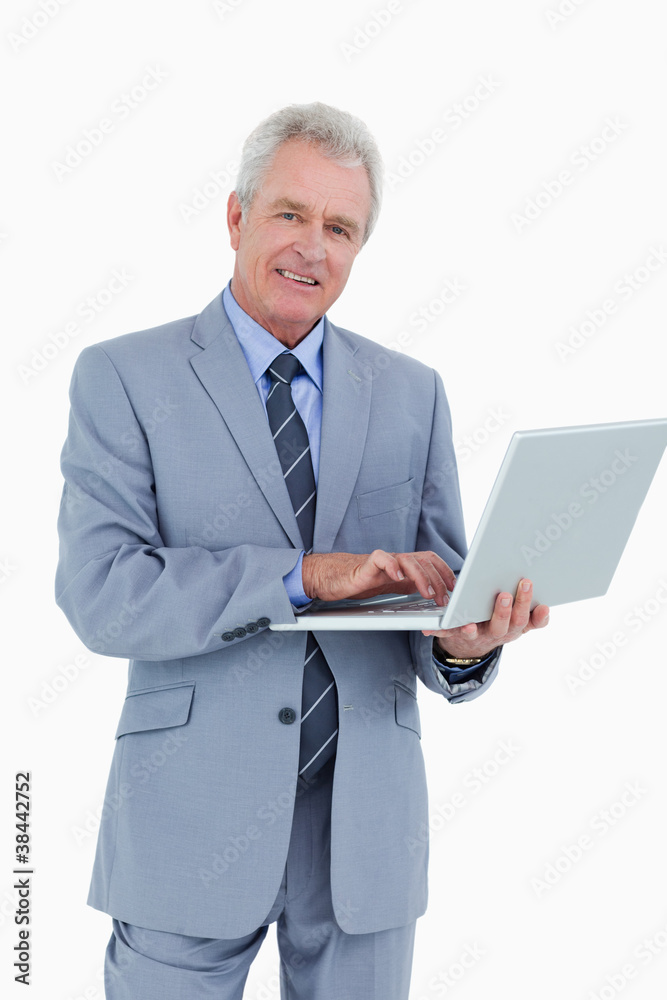 Smiling mature tradesman with his notebook Smiling mature tradesman with his notebook