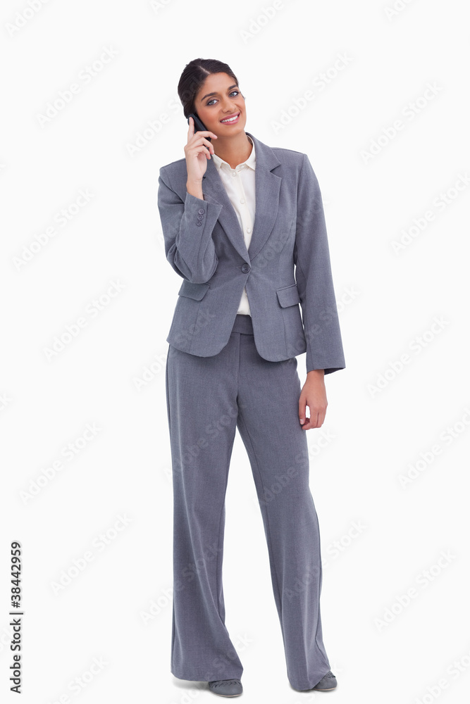 Smiling female entrepreneur on her cellphone Smiling female entrepreneur on her cellphone