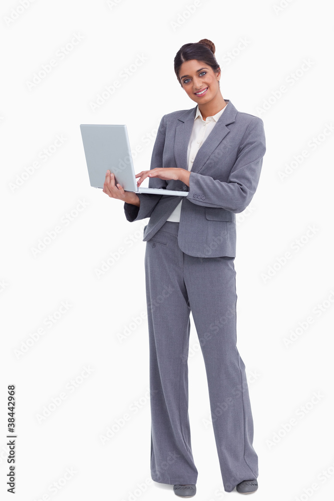 Smiling female entrepreneur with her laptop