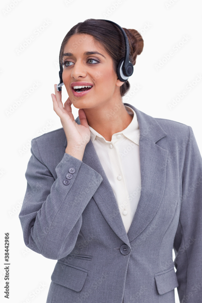 Female call center employee looking to the side Female call center employee looking to the side