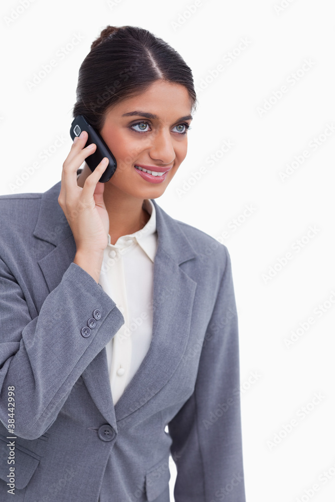Smiling female entrepreneur on her mobile phone Smiling female entrepreneur on her mobile phone
