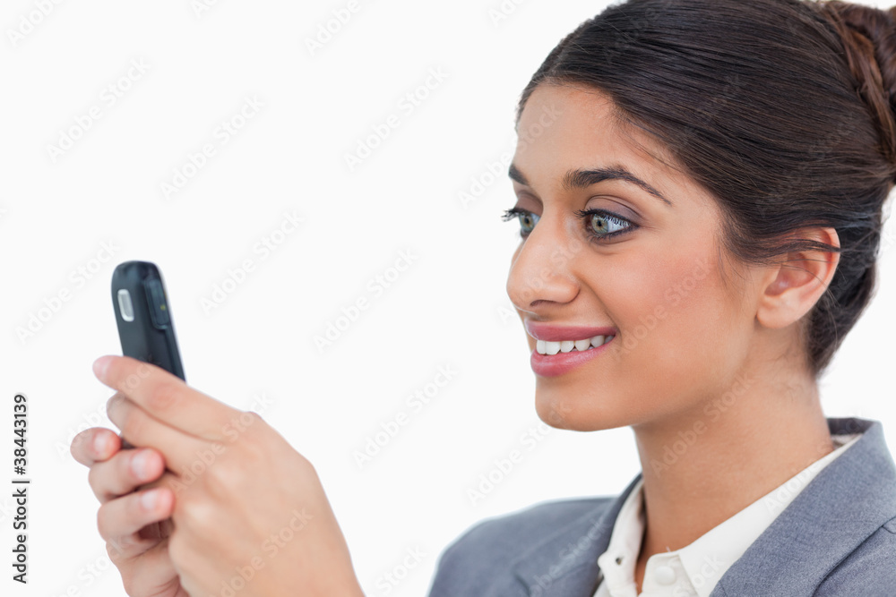 Close up side view of female entrepreneur reading text message Close up side view of female entrepreneur reading text message