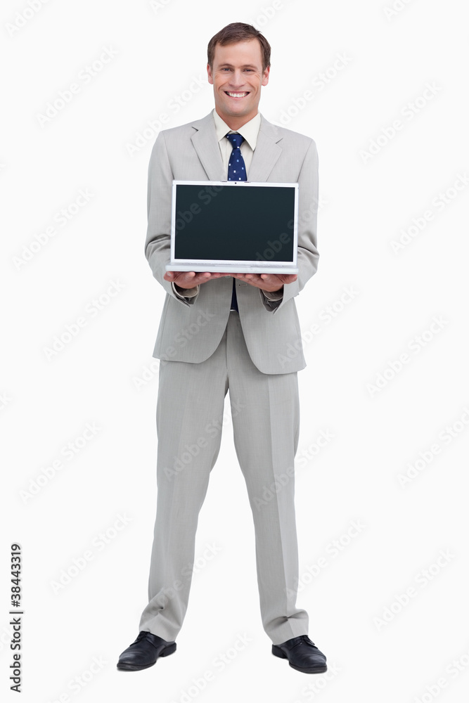 Smiling businessman presenting screen of his laptop