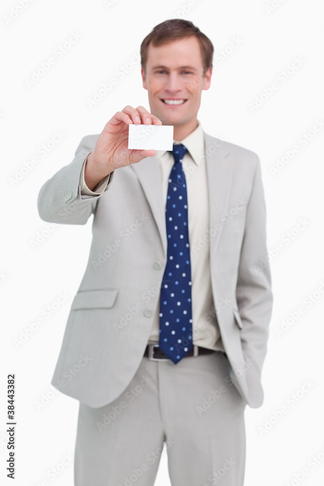Smiling businessman presenting his business card Smiling businessman presenting his business card