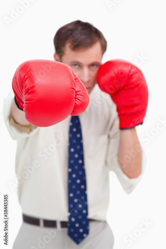 Close up of businessman's fist attacking