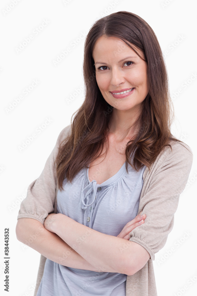Close up of smiling woman with her arms crossed Close up of smiling woman with her arms crossed