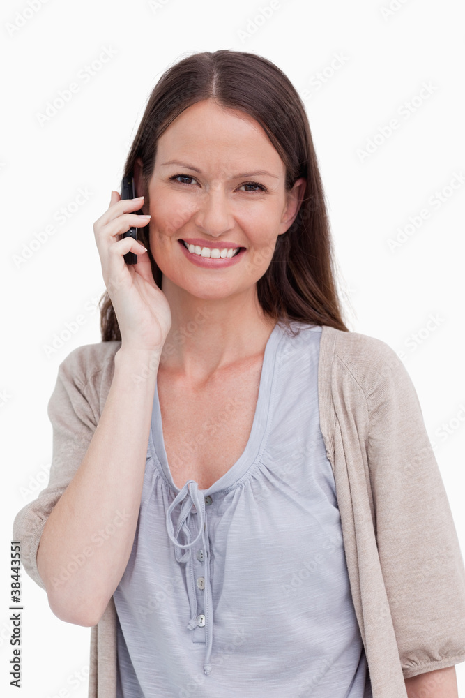 Close up of smiling young woman on her cellphone Close up of smiling young woman on her cellphone