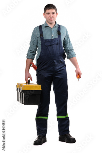Mechanic with tools isolated on the white background