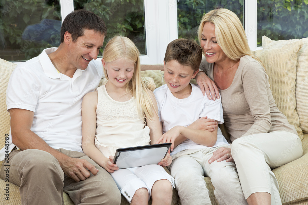 Happy Family Having Fun Using Tablet Computer At Home Happy Family Having Fun Using Tablet Computer At Home