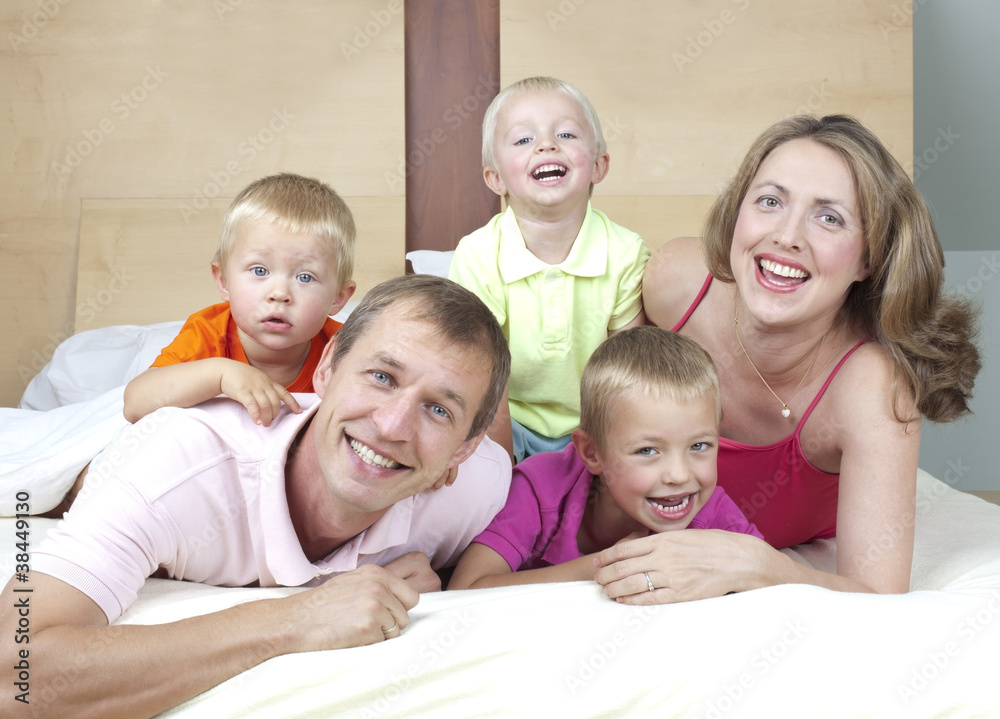 Happy family in bed